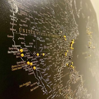 push-pin-world-map-customer-photo-midnight-black-map-with-gold-pins